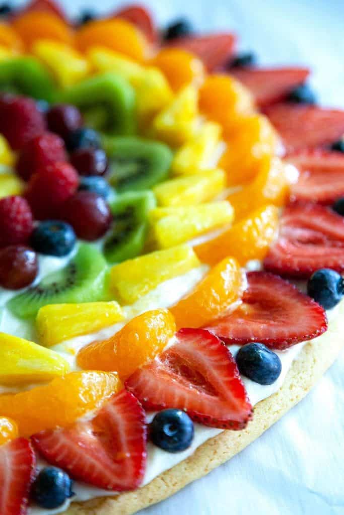 Fruit Pizza - The BEST summer dessert!  With a soft sugar cookie crust, dreamy cream cheese frosting, and topped with fresh fruit. Super simple to make and always a hit!