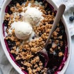 Quick and Easy Blueberry Crisp is bursting with sweet, juicy blueberries and a crunchy oat topping. This easy fruit crisp recipe is perfect served warm from the oven topped with a scoop of vanilla ice cream. The easiest dessert recipe EVER!
