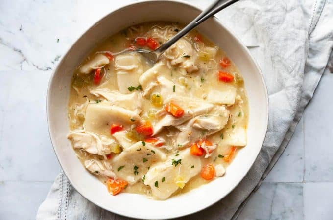 Old-fashioned Chicken and Dumplings - soft, pillowy dumplings and tender chicken in a rich, flavorful broth. With both made from scratch and quick and easy versions. Truly comfort food at its finest!
