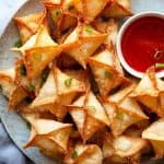 The BEST Crab Rangoon - A lush and creamy crab and cream cheese filling in a crispy wonton – the perfect party appetizer or game day snack recipe! With instructions for frying, baking, or air frying, they’re easy to make and always a hit!
