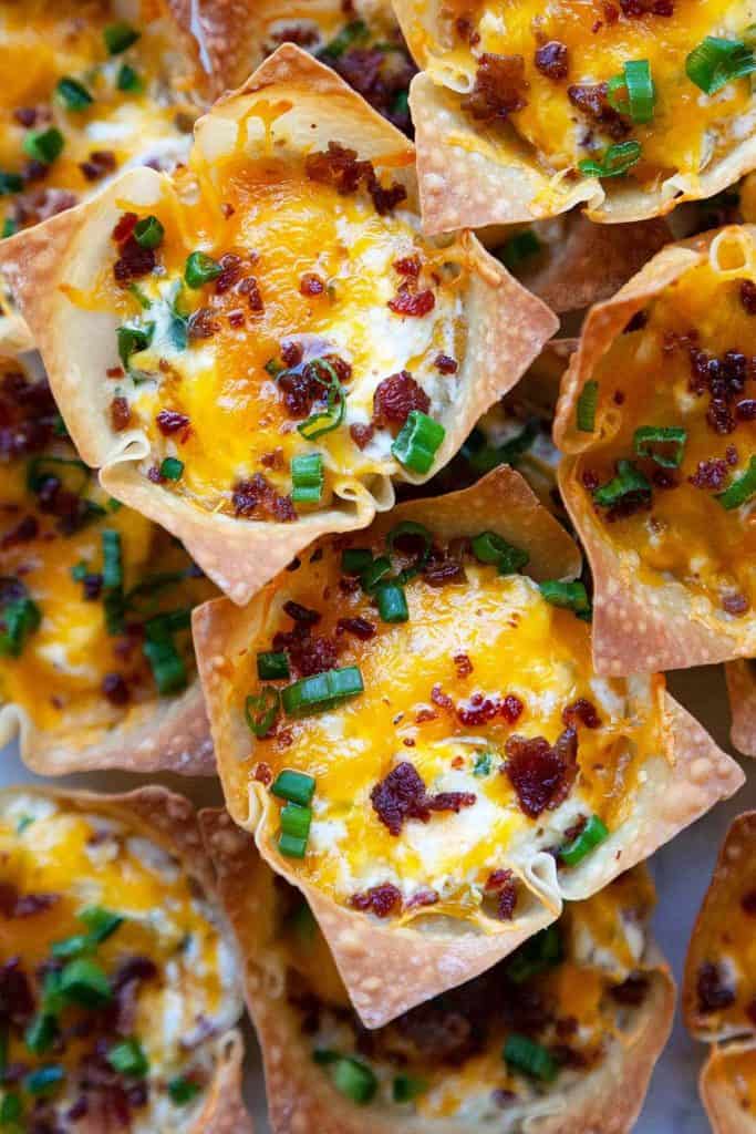 Jalapeno Popper Wonton Cups – delicious little bites of cream cheese, cheddar, sour cream, and bacon baked in crispy wonton wrapper cups. The perfect party appetizer and game day snack!