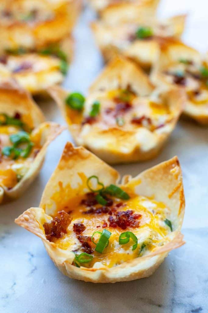 Jalapeno Popper Wonton Cups – delicious little bites of cream cheese, cheddar, sour cream, and bacon baked in crispy wonton wrapper cups. The perfect party appetizer and game day snack!