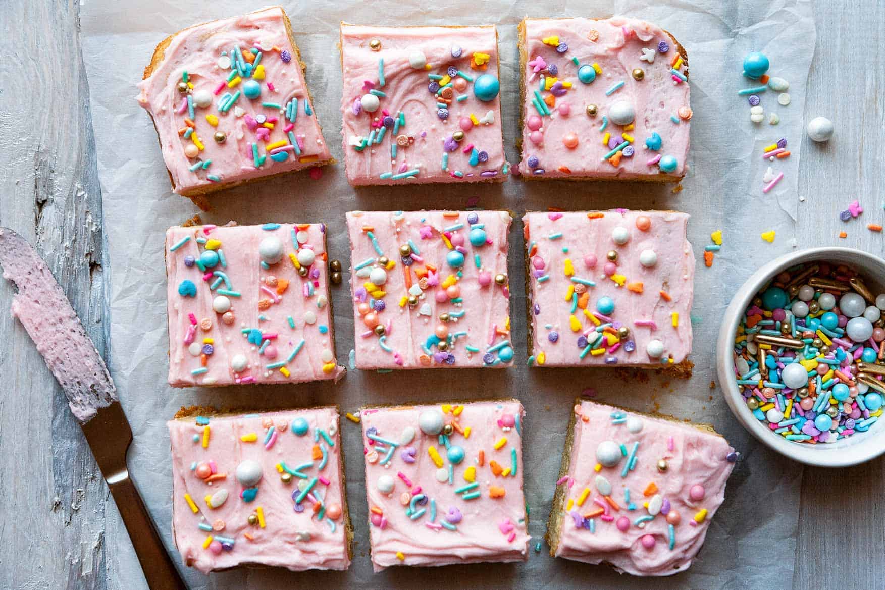 The BEST thick and chewy Sugar Cookie Bars with vanilla buttercream frosting. Quick and easy to make bar cookies recipe! #dessert #homemade #fromscratch
