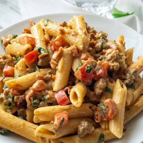 Creamy Italian Sausage and Tomato Pasta | Foodtasia