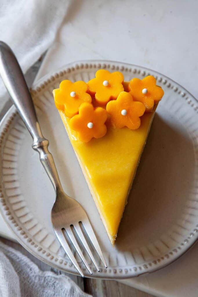 a slice of mango cheesecake