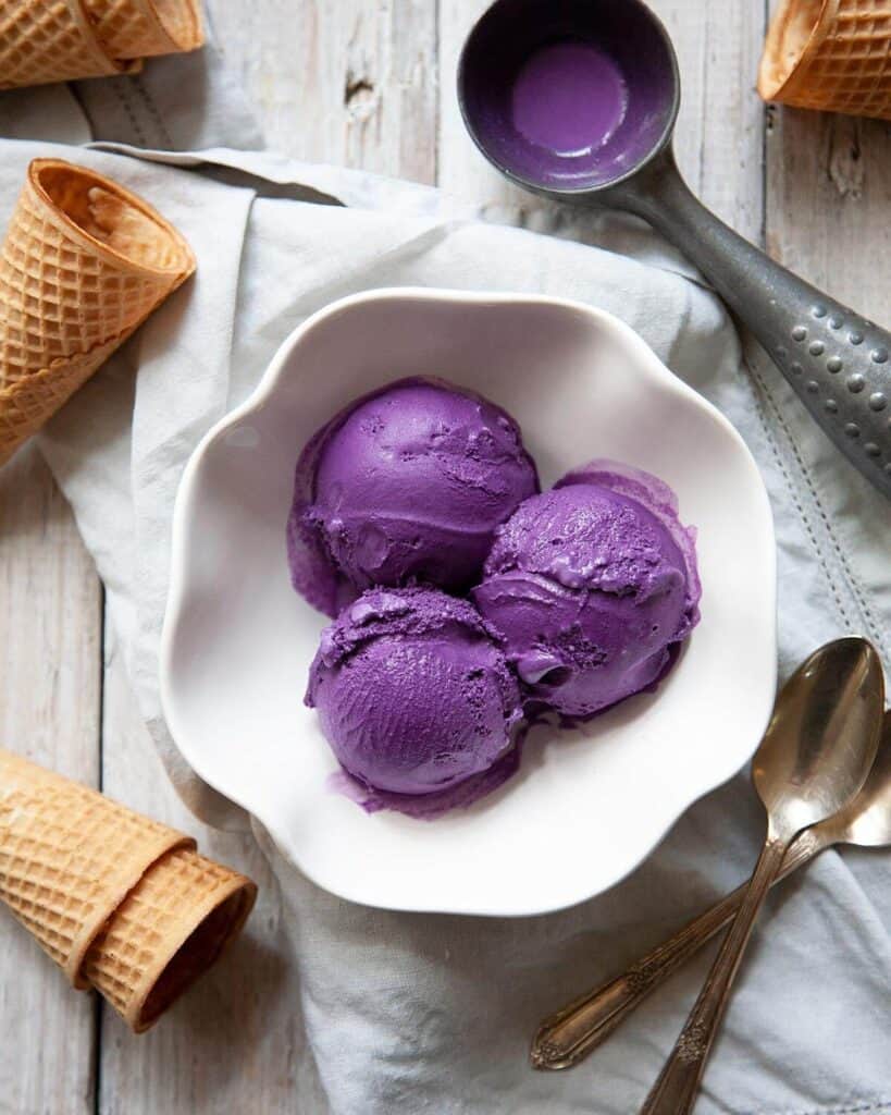ube ice cream scoops in bowl