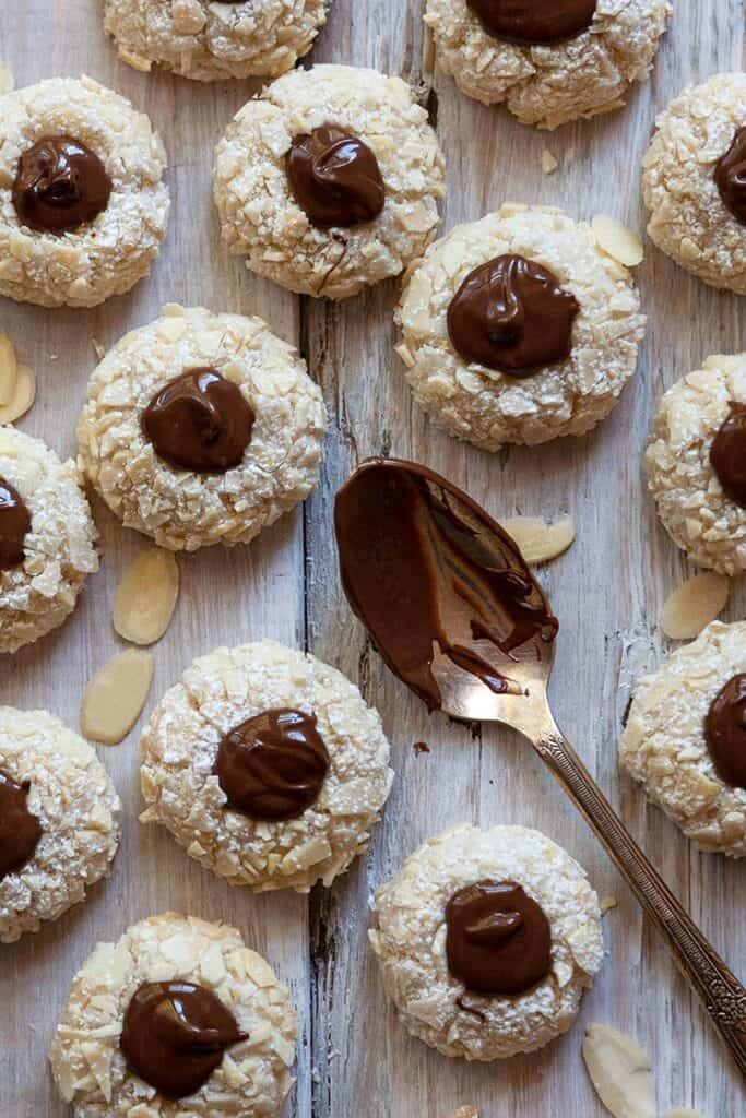 almond macaroons with almond slices and chocolate thumbprints