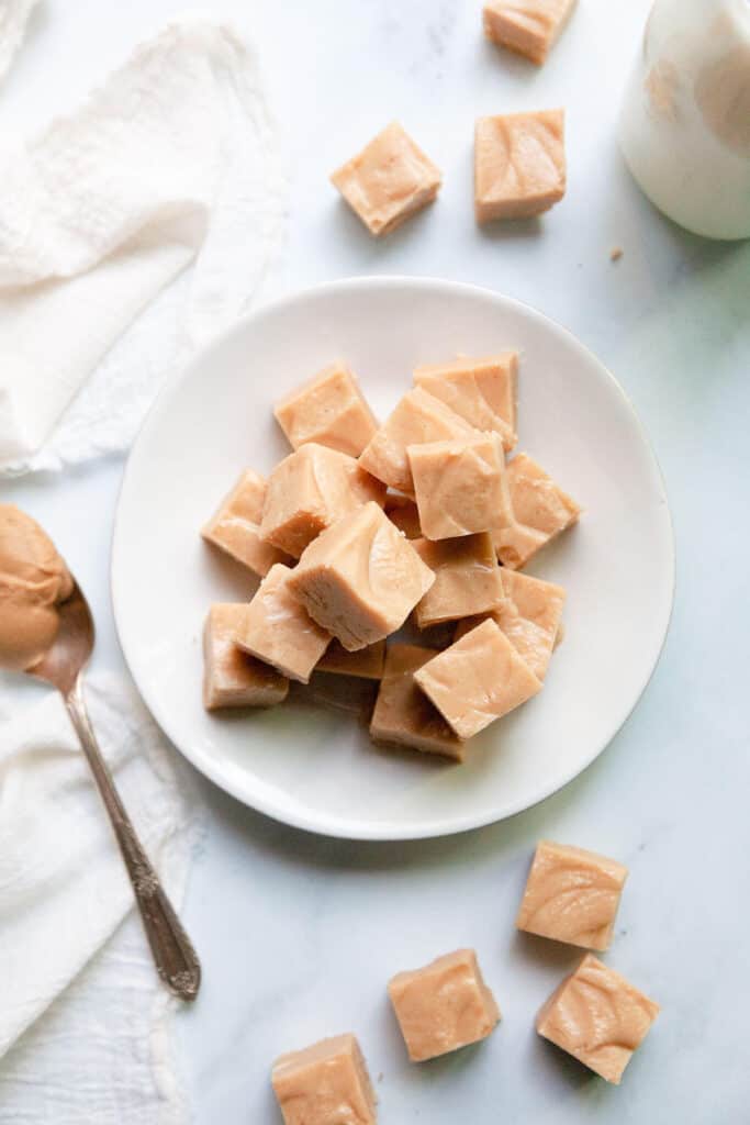 peanut butter fudge stacked on a plate
