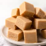 peanut butter fudge stacked on a plate